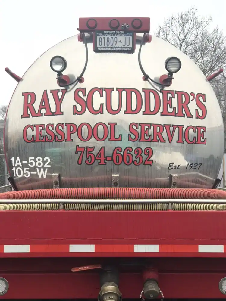 Cesspool service truck with Ray Scudder signage and contact info.